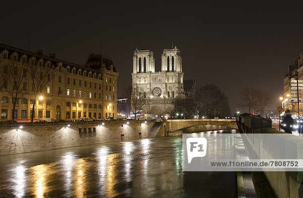 France Paris View of Notre Dame de Paris and River Seine by night