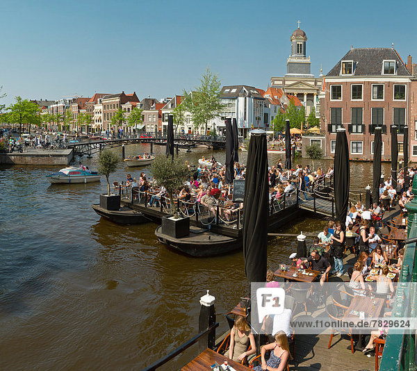 Netherlands  Holland  Europe  Leiden  Footbridge  bridge  canal  city  village  water  spring  people  ships  boat  outdoor  cafe
