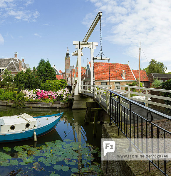 Netherlands  Holland  Europe  Edam  Wooden  bridge  drawbridge  belltower  city  village  water  flowers  summer