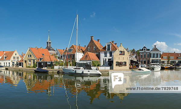 Netherlands  Holland  Europe  Makkum  Historic  centre  canal  city  village  water  summer  ships  boat  reflections