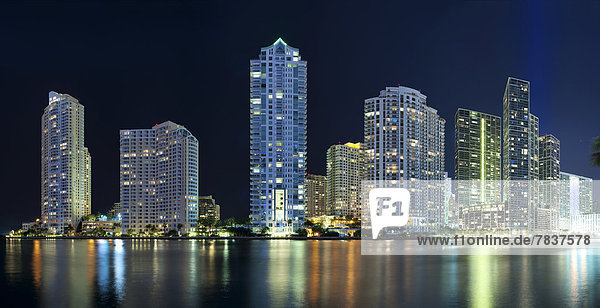 Skyline at night  with Three Tequesta Point  One Tequesta Point  Asia Condominium  Carbonell Condominium  Icon Brickell South Tower  Icon Brickell North Tower  Viceroy  Rivergate Plaza and 550 Bric  from left to right