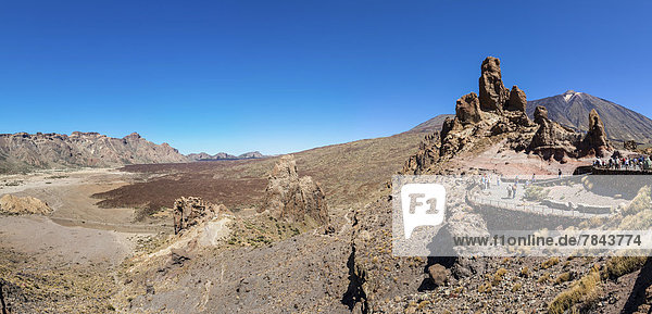 Lava rock in Teide National Park  Mount Teide volcano or Pico del Teide on the right  UNESCO World Natural Heritage Site