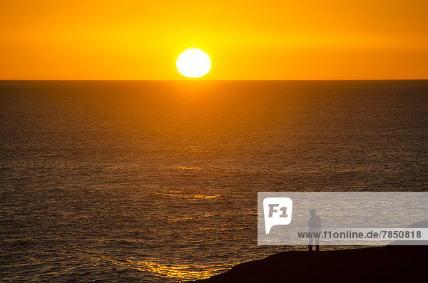 Spain  View of man by atlantic ocean at sunset