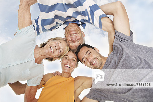 Spain  Portrait of family on beach at Palma de Mallorca  smiling