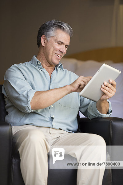 Caucasian man using tablet computer