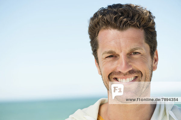Portrait of a man smiling on the beach