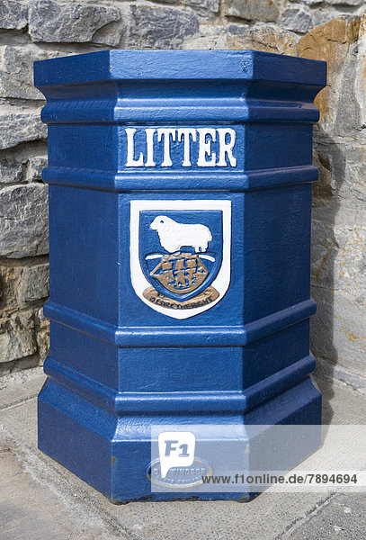 'Litter bin with the coat of arms of the Falkland Islands and the motto ''Desire the Right'''