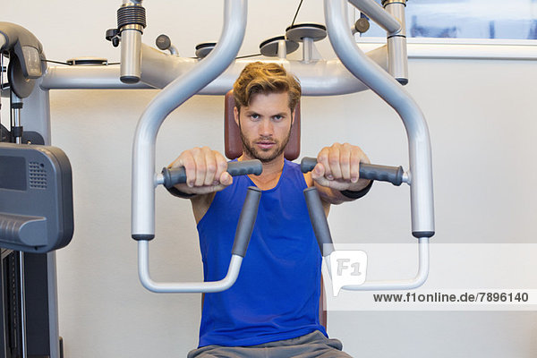 Portrait of a man exercising in a gym