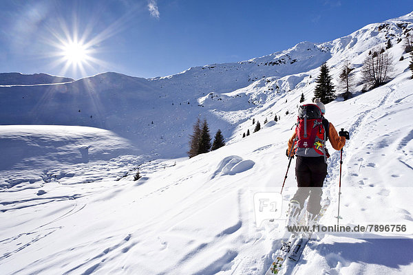 Cross-country skier ascending Wurzer Alpenspitz Mountain in the Ridnauntal Valley