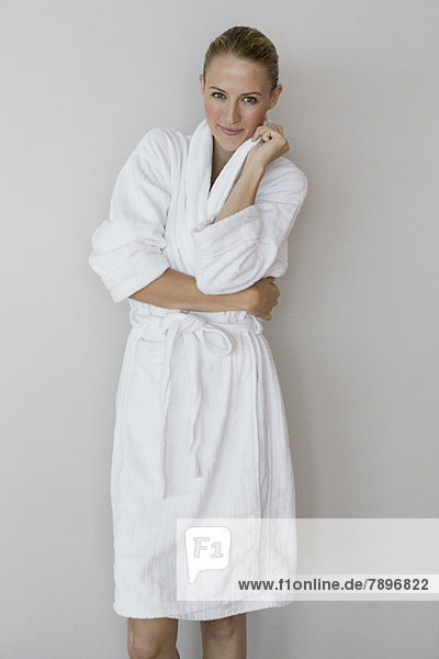 Portrait of a woman in bathrobe at spa