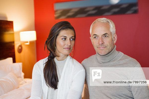 Couple sitting together in a hotel room