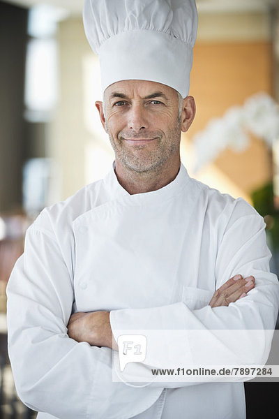 Portrait of a chef smiling with arms crossed
