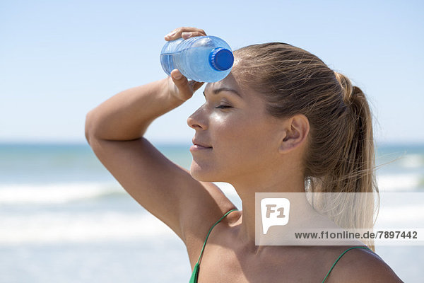 Close-up of a woman with a water bottle
