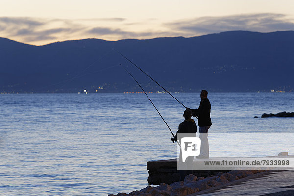 Anglers at dusk