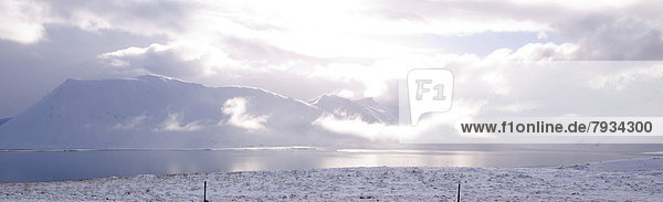 Volcanic lake with snow capped mountains on Ring Road No 1