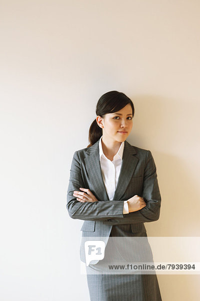 Businesswoman with crossed arms looking at camera