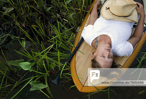 Woman naps on a SUP