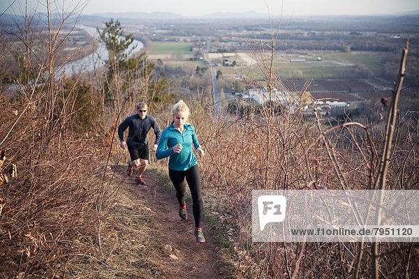 Trail runners acsend South Sugarloaf mountain in the Connecticut River Valley of western Massachusetts