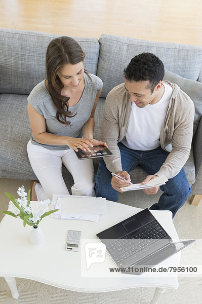 Young couple doing home finances