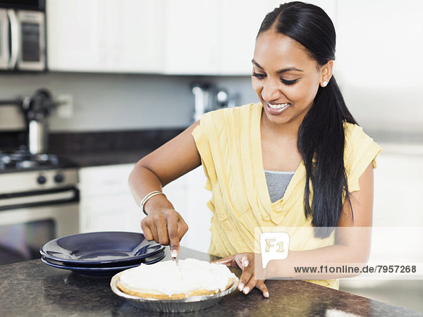 Woman preparing meal in kitchen