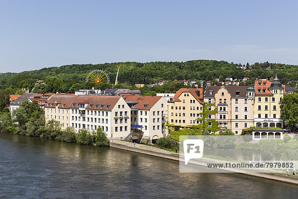 Germany  Bavaria  Regensburg  View of Danube Island with buildings and Ferris wheel in background