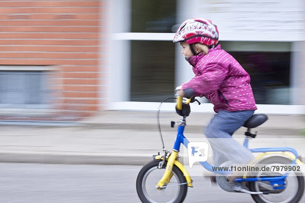 Girl riding bicycle