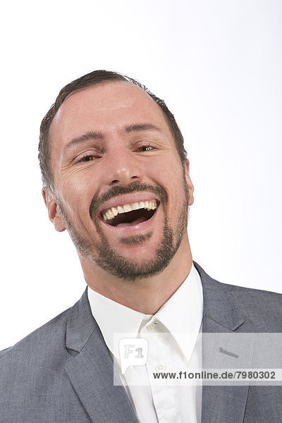 Portrait of businessman laughing  close up