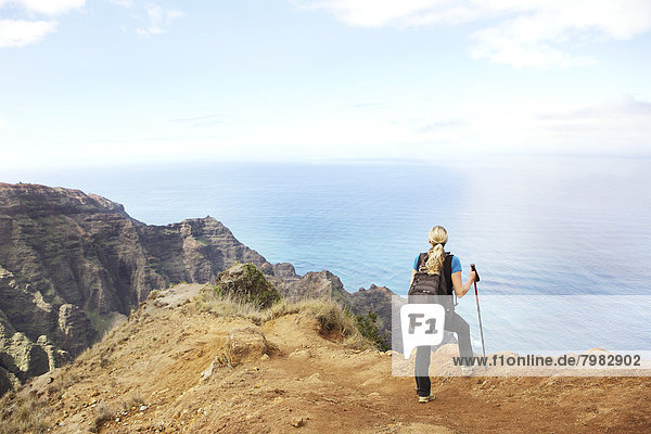 USA  Hawaii  Mid adult woman standing on top of mountain