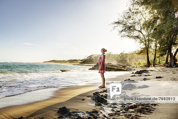USA  Hawaii  Mid adult woman standing on beach
