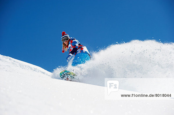 Snowboarderin in Aktion