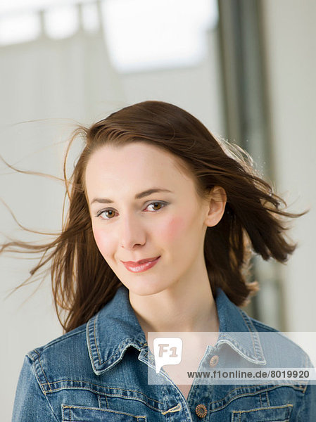 Young woman with windswept hair  portrait