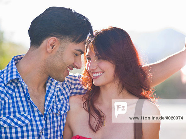 Young couple smiling at each other  close up