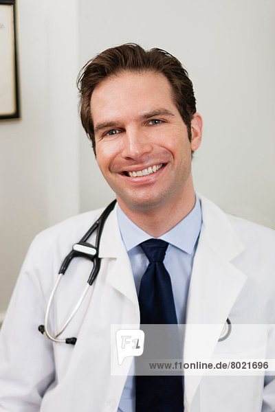 Mid adult doctor smiling  portrait
