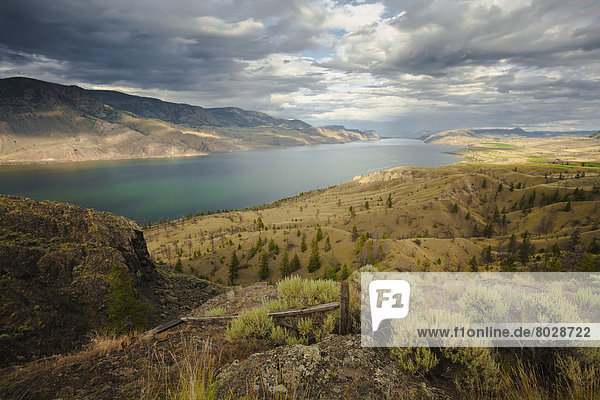 Scattered clouds over kamloops lake and the dry hills surrounding it Kamloops british columbia canada