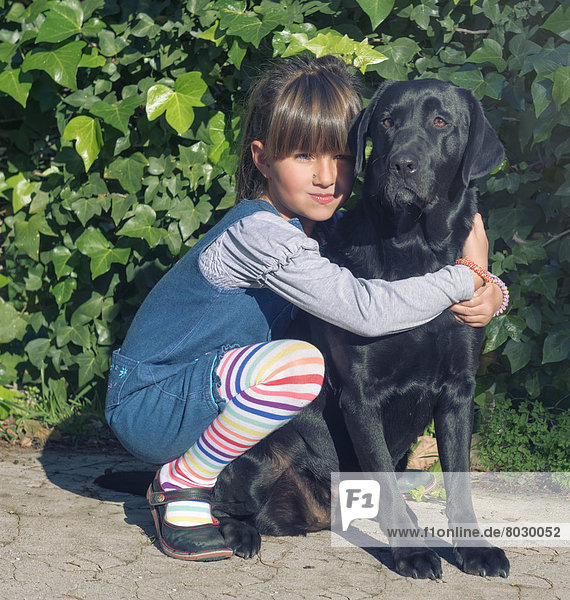 Young girl with her pet labrador Malaga andalusia spain