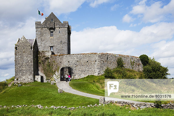 Tourists on a footpath at dunguaire castle Kinvara county galway ireland