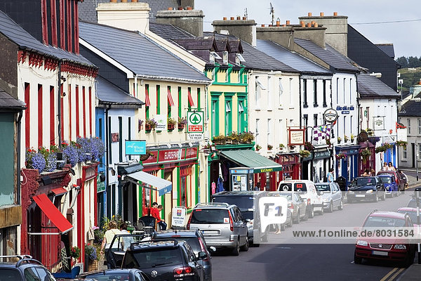 Busy street and colourful buildings in an irish village Schull county cork ireland