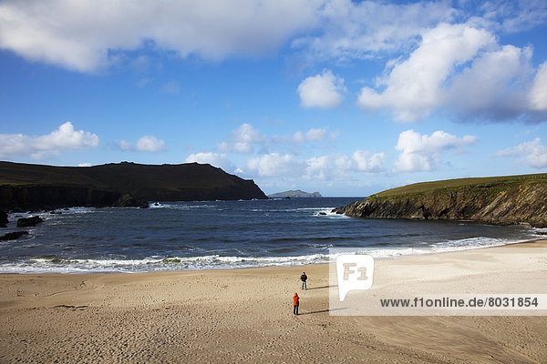People walking on clogher beach in dingle County kerry ireland