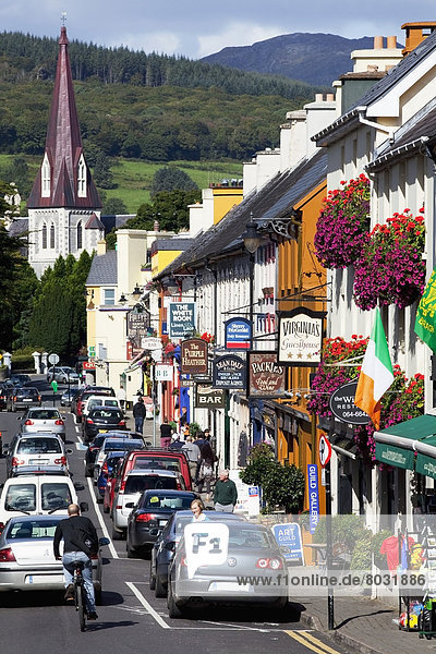 Cars and colourful buildings along henry street Kenmare county kerry ireland