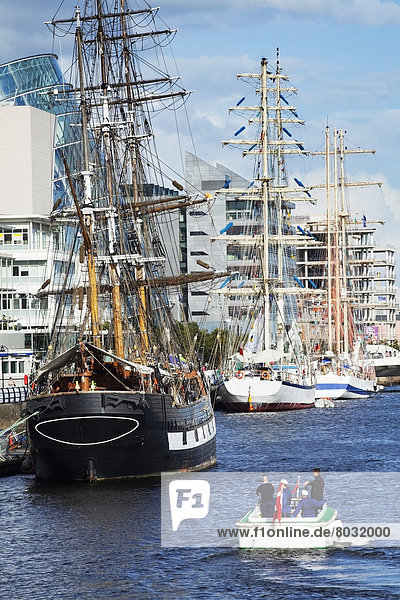 Large ships along the water's edge of the river liffey for the tall ship race Dublin county dublin ireland