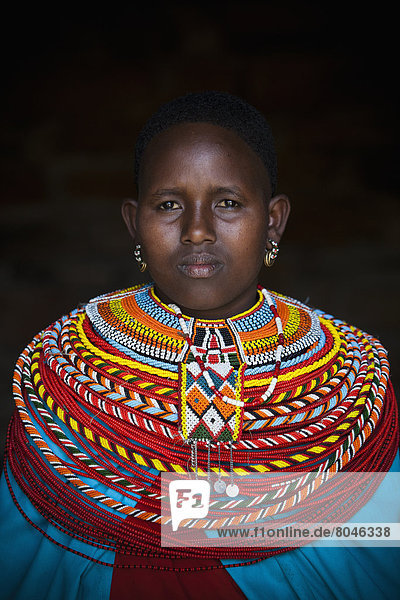 Portrait of young Samburu woman in traditional dress  South Horr  Kenya