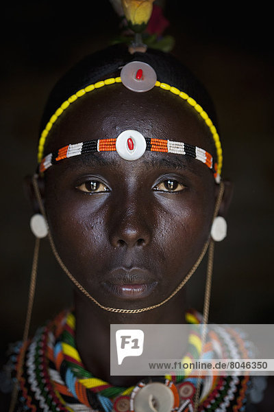 Portrait of young Samburu man in traditional dress  South Horr  Kenya