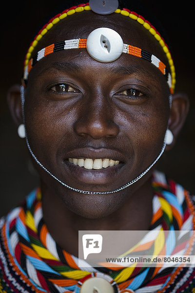 Portrait of young Samburu man in traditional dress  South Horr  Kenya