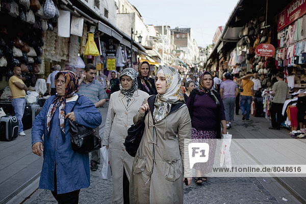 Turkey  Women in head scarves shopping in Clothes market which stretches from Grand Bazaar to Egyptian Bazaar  Istanbul