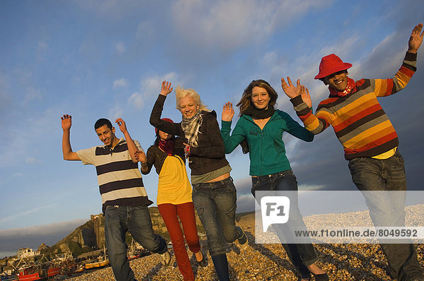 Mixed group of teenagers at seaside  Hastings  UK