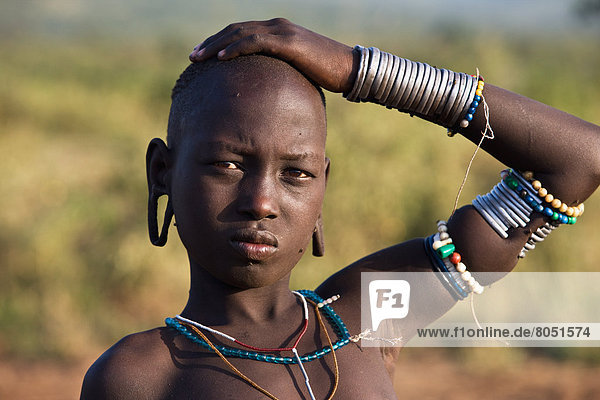 Portrait of Young Mursi boy  Dirikoro  Southern Mursiland  Omo Valley  Ethiopia