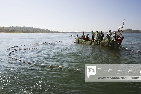 Fishermen fishing with large net on boat  Than Pan Ley  Irrawaddyi Division  Myanmar (Burma)