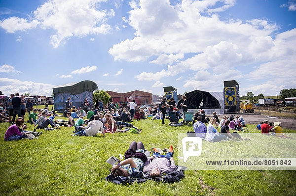 Festival goers relaxing at Indietracks Festival  Midland Railway  Derbyshire  England  UK