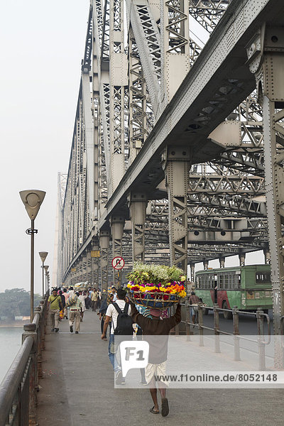 View of people crossing Howrah Bridge  Calcutta  West Bengal  India