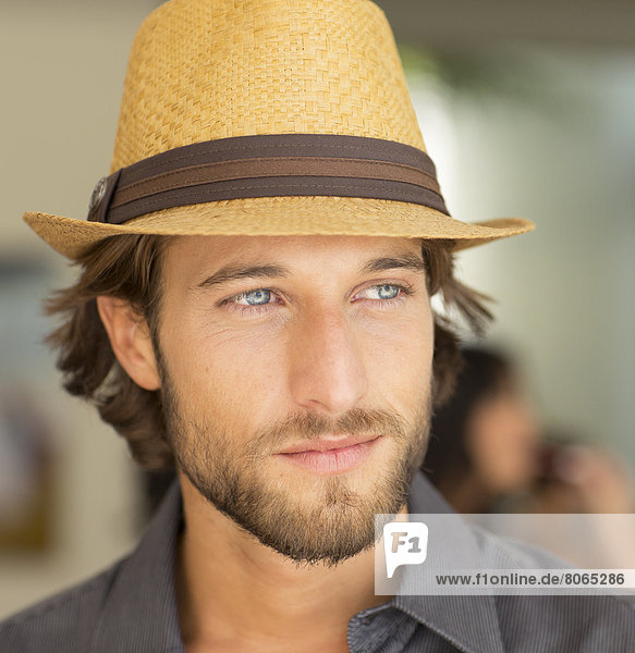Smiling man wearing straw hat